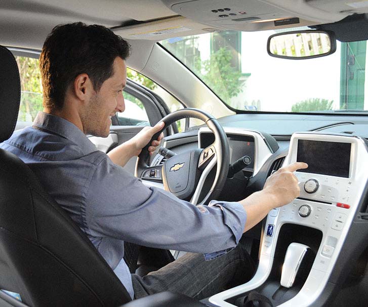 Man on the driver seat using the GPS