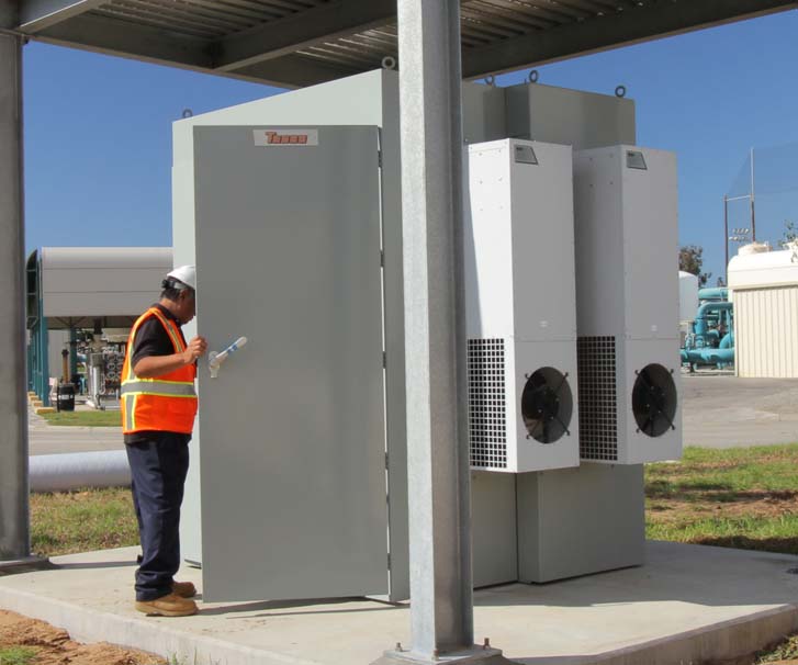 A worker checking power usage