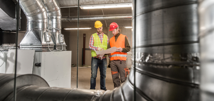 Two men in hard hats