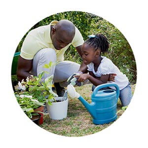 father and daughter in garden